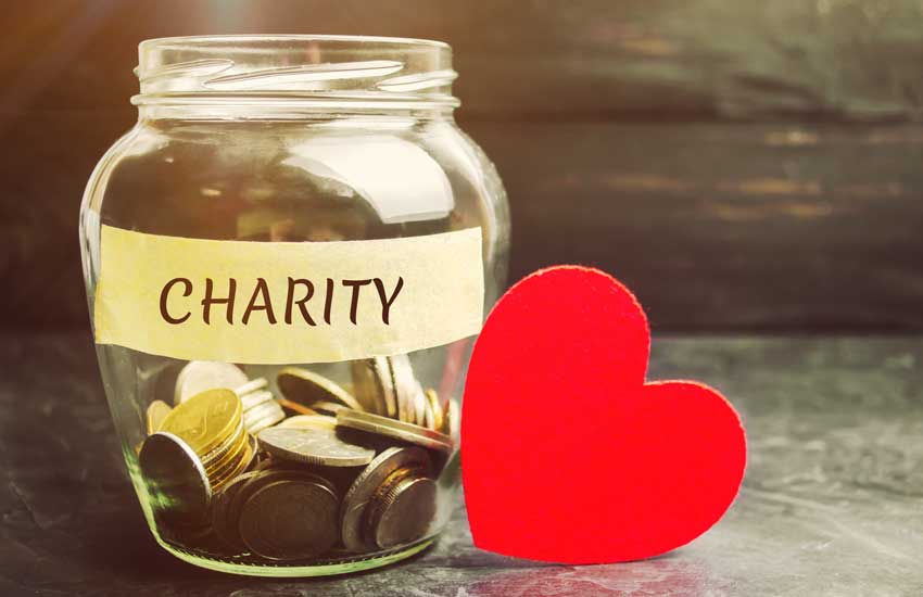 Glass Jar With The Words Charity And The Heart. The Concept Of A